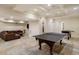 Spacious finished basement featuring a game area, ping pong table, and comfortable seating at 46 Montclair Ne Dr, Atlanta, GA 30309