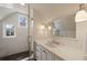 Bathroom featuring a sleek vanity with white countertop, modern fixtures, and a glass enclosed shower at 46 Montclair Ne Dr, Atlanta, GA 30309