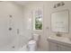 Clean bathroom with glass shower, hexagon tiles, and bright vanity at 46 Montclair Ne Dr, Atlanta, GA 30309