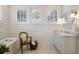 Charming bathroom with a vintage-style tub, shiplap walls, and marble countertop vanity at 46 Montclair Ne Dr, Atlanta, GA 30309