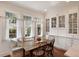 Charming breakfast nook with a built-in bench, rustic wooden table, and an abundance of natural light from surrounding windows at 46 Montclair Ne Dr, Atlanta, GA 30309