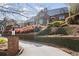 Stunning brick home featuring mature landscaping and a manicured lawn with a private drive at 46 Montclair Ne Dr, Atlanta, GA 30309