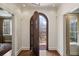 Inviting foyer showcasing hardwood floors and an arched doorway to the front yard at 46 Montclair Ne Dr, Atlanta, GA 30309