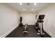 Home gym with workout equipment, a punching bag, and black rubber flooring at 46 Montclair Ne Dr, Atlanta, GA 30309