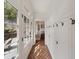 Inviting hallway with brick floors, white wainscoting, and a view of the backyard at 46 Montclair Ne Dr, Atlanta, GA 30309