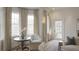 Bright living area with large windows, patterned curtains, and a cozy sitting area at 46 Montclair Ne Dr, Atlanta, GA 30309
