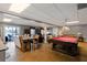 Finished basement with a kitchen, pool table, and a seating area at 5168 Parkview Rd, Social Circle, GA 30025