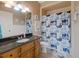 Bathroom featuring a granite vanity and a shower with blue and white whale shower curtain at 5168 Parkview Rd, Social Circle, GA 30025