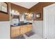 Bathroom featuring double sinks, a granite countertop, and stylish fixtures at 5168 Parkview Rd, Social Circle, GA 30025
