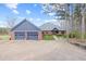 Charming brick home featuring an attached two-car garage and brick paver driveway at 5168 Parkview Rd, Social Circle, GA 30025