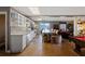 Basement kitchen featuring white cabinets, granite countertops, and seating for four at the island at 5168 Parkview Rd, Social Circle, GA 30025