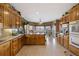 Spacious kitchen with an island, double ovens, breakfast nook and wood cabinetry at 5168 Parkview Rd, Social Circle, GA 30025