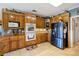 Modern kitchen with stainless steel appliances, granite countertops, and custom cabinetry at 5168 Parkview Rd, Social Circle, GA 30025