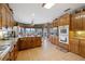 Open kitchen featuring a central island, double ovens, granite countertops, and an adjacent breakfast nook at 5168 Parkview Rd, Social Circle, GA 30025