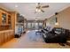 Spacious living room featuring a fireplace, built-in shelving, and access to the outdoor deck at 5168 Parkview Rd, Social Circle, GA 30025