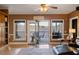 Bright living room with access to an outdoor deck and lake views through large windows at 5168 Parkview Rd, Social Circle, GA 30025