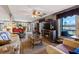 Spacious finished basement with kitchen, living room with fireplace, and a pool table in the background at 5168 Parkview Rd, Social Circle, GA 30025