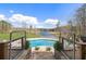 Beautiful view of the pool with a view of the beautiful lake in the background, surrounded by greenery at 5168 Parkview Rd, Social Circle, GA 30025