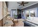 Spacious covered porch with wicker furniture and a cozy ambiance for outdoor enjoyment at 5168 Parkview Rd, Social Circle, GA 30025