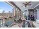 Covered outdoor porch with scenic views of a pool and landscape, ideal for leisure at 5168 Parkview Rd, Social Circle, GA 30025