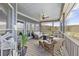 Comfortable outdoor porch area with wicker furniture, perfect for entertaining and relaxation at 5168 Parkview Rd, Social Circle, GA 30025