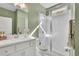 Modern bathroom with a glass-enclosed shower, white subway tile, and vanity at 812 Newsome Nw Aly, Marietta, GA 30064