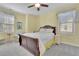 Bedroom with yellow walls, side table, and floral patterned bedding at 812 Newsome Nw Aly, Marietta, GA 30064