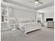 Spacious bedroom featuring plush carpet, a ceiling fan, and white trim at 812 Newsome Nw Aly, Marietta, GA 30064