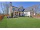Stately home featuring a manicured lawn, fenced yard, and inviting front porch at 812 Newsome Nw Aly, Marietta, GA 30064