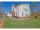 Beautiful two-story home with a brick chimney, manicured landscaping, and green grass at 812 Newsome Nw Aly, Marietta, GA 30064