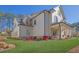 Well maintained two-story home with green grass, manicured landscaping, and white siding at 812 Newsome Nw Aly, Marietta, GA 30064