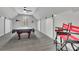 Spacious game room with pool table, ceiling fan, natural light, and UGA decor at 812 Newsome Nw Aly, Marietta, GA 30064