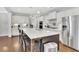 Bright kitchen featuring a large island, stainless steel refrigerator, and white cabinets at 812 Newsome Nw Aly, Marietta, GA 30064