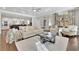 Cozy living room featuring hardwood floors, neutral tones, and a view to the kitchen at 812 Newsome Nw Aly, Marietta, GA 30064