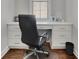 Home office space with built in cabinets and a sleek, modern desk at 812 Newsome Nw Aly, Marietta, GA 30064
