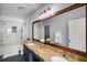 Bright bathroom featuring double sinks, granite countertops, and a decorative mirror with wood frame at 821 Ralph Mcgill Ne Blvd # 2210, Atlanta, GA 30306