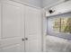 Carpeted bedroom with a ceiling fan, large window, and a view of the closet at 821 Ralph Mcgill Ne Blvd # 2210, Atlanta, GA 30306