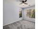 Spacious carpeted bedroom featuring natural light from two windows and a ceiling fan at 821 Ralph Mcgill Ne Blvd # 2210, Atlanta, GA 30306