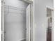 Open closet with wire shelving and white door, adjacent to a hallway leading to more rooms at 821 Ralph Mcgill Ne Blvd # 2210, Atlanta, GA 30306
