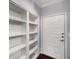 Bright entryway with built-in shelves and a crisp white front door at 821 Ralph Mcgill Ne Blvd # 2210, Atlanta, GA 30306