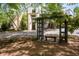 Beautiful apartment building featuring lush trees and a charming pergola with bench at 821 Ralph Mcgill Ne Blvd # 2210, Atlanta, GA 30306