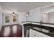 Open kitchen featuring granite countertops, stainless steel appliances, and views into the living area at 821 Ralph Mcgill Ne Blvd # 2210, Atlanta, GA 30306