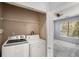 Laundry room featuring washer, dryer, and shelving, conveniently located near the bedroom at 821 Ralph Mcgill Ne Blvd # 2210, Atlanta, GA 30306