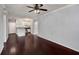 Living room with ceiling fan, hardwood floors, and an open layout into the kitchen area at 821 Ralph Mcgill Ne Blvd # 2210, Atlanta, GA 30306