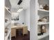 Comfortable home office area with built-in shelving, designer lighting, and neutral colors at 821 Ralph Mcgill Ne Blvd # 2210, Atlanta, GA 30306