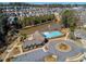 Aerial view of community amenities: pool, clubhouse, and pond nestled among beautiful homes at 187 Still Pine Bnd, Smyrna, GA 30082