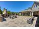 Expansive backyard patio with built-in stone fireplace and comfortable seating arrangements at 187 Still Pine Bnd, Smyrna, GA 30082