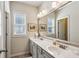 Bright bathroom featuring a double vanity with a large mirror and natural light at 187 Still Pine Bnd, Smyrna, GA 30082
