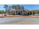 Exterior view of the community clubhouse, featuring a well-maintained landscape at 187 Still Pine Bnd, Smyrna, GA 30082