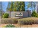 Elegant Smyrna Grove community entrance sign surrounded by lush landscaping at 187 Still Pine Bnd, Smyrna, GA 30082
